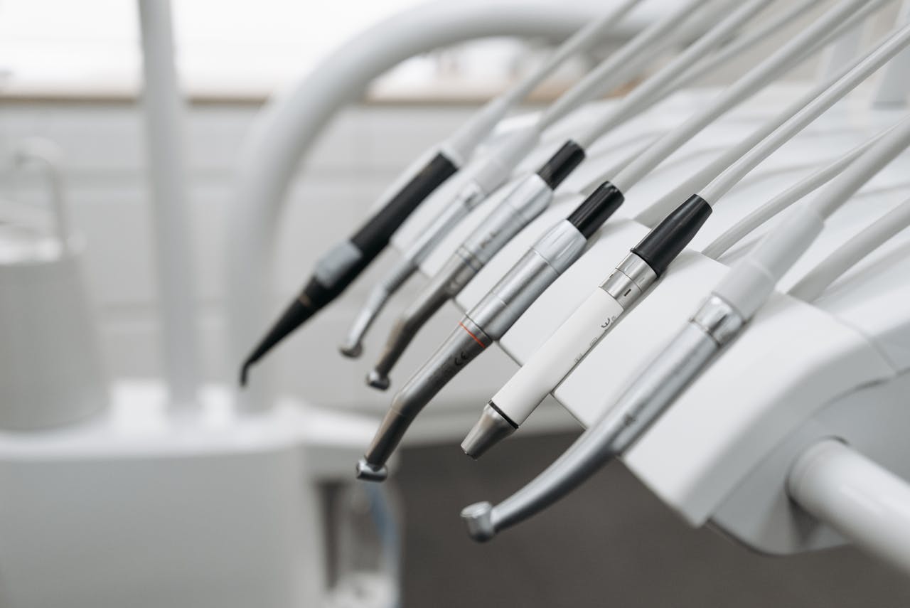 A detailed view of dental instruments neatly arranged for professional dental care.